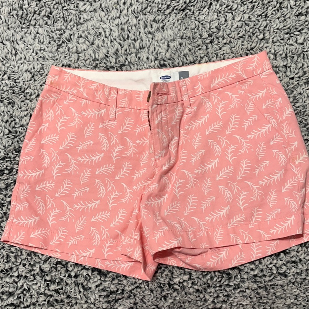 Light pink and white patterned shorts.